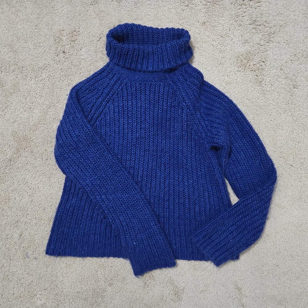 Navy blue cable knit turtleneck sweater